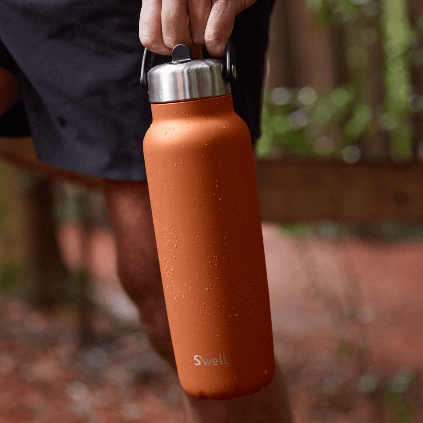 explorer-with-flip-straw-lid-40oz-y7 Swell-Explorer-Water-Bottle-40oz-Orange-Carnelian-LifeStyle.png