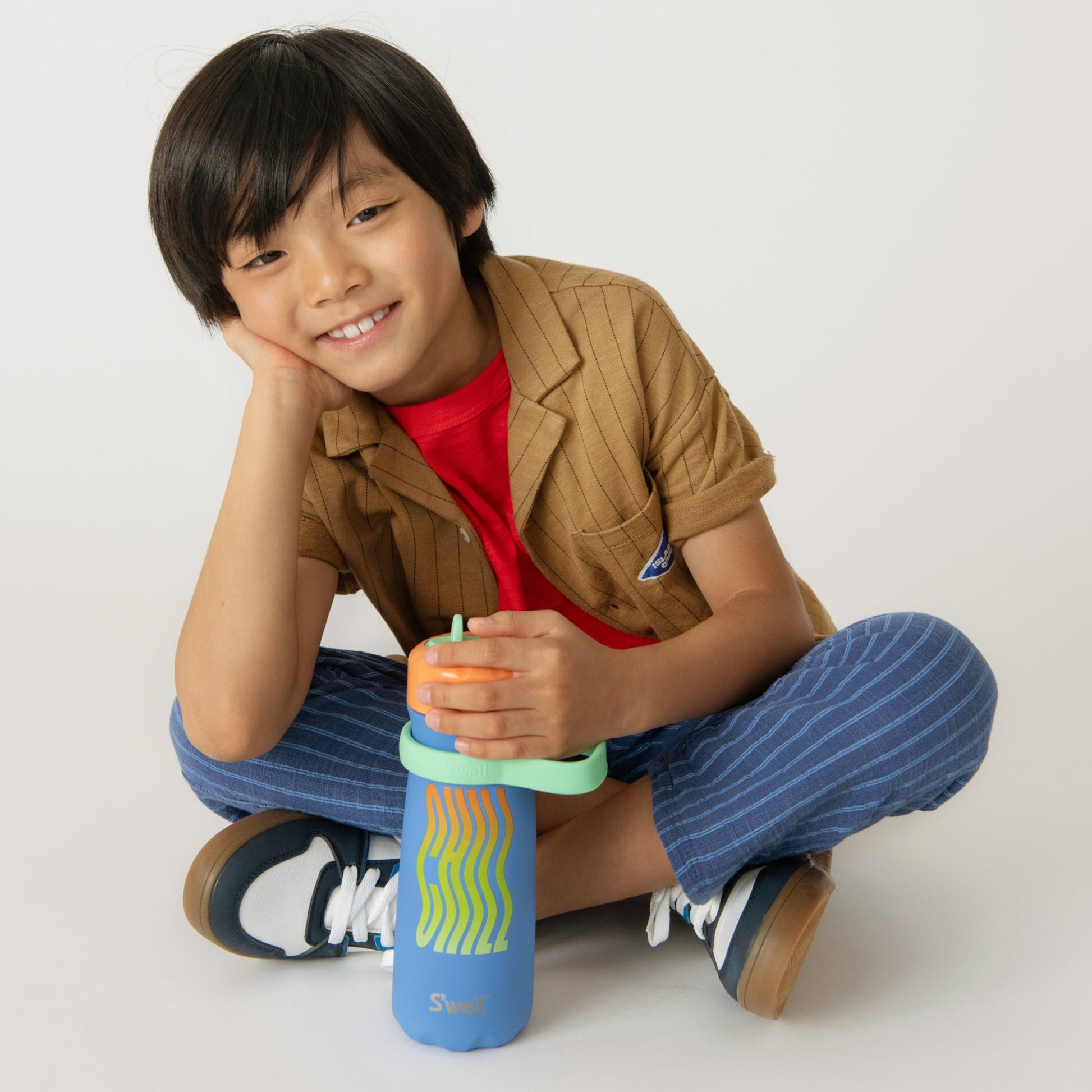 traveler-with-flip-straw-lid-16oz-h9 Swell-Kids-Water-Bottle-Traveler-16oz-Blue-Chill-Lifestyle.jpg